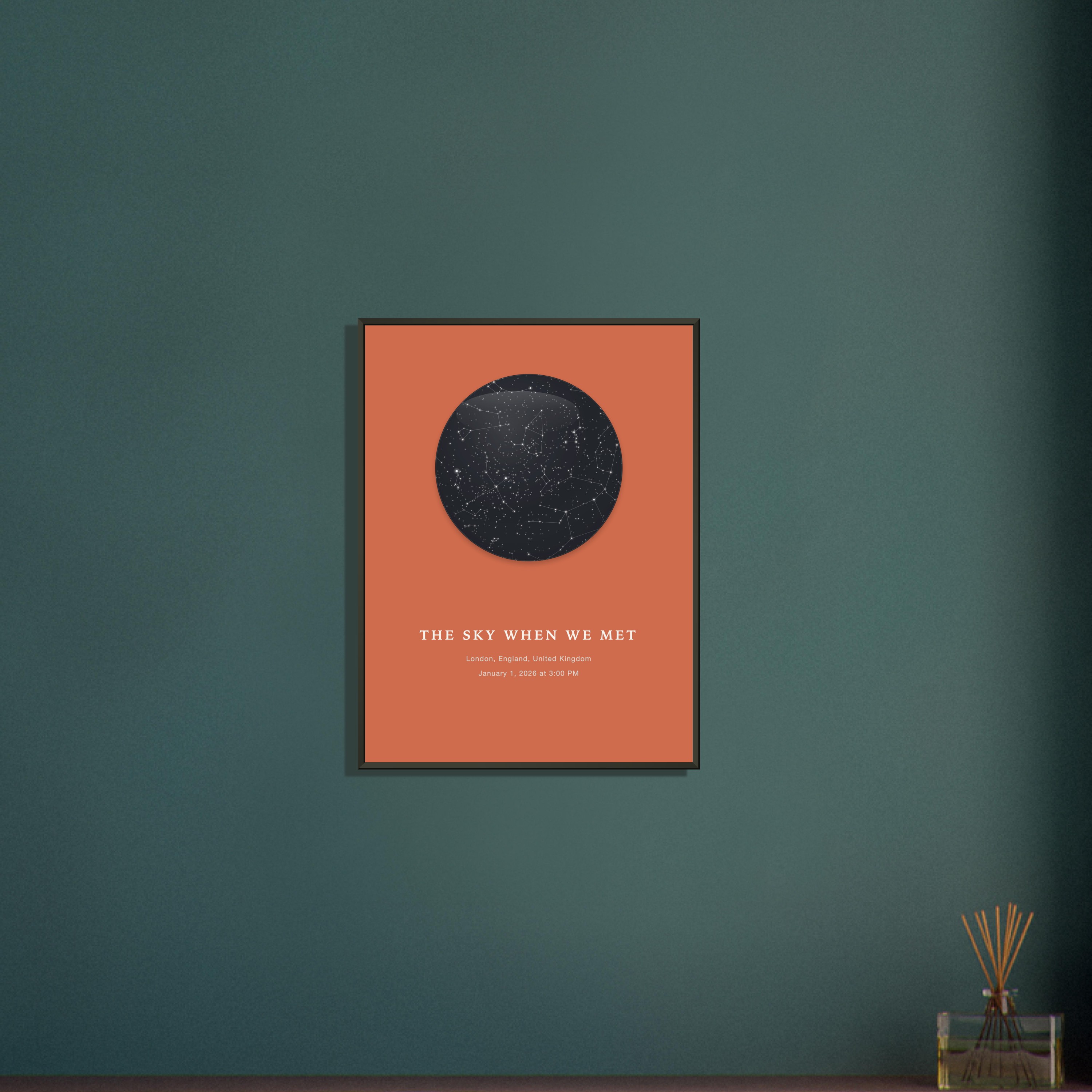 Close-up of a framed personalized night sky print on emerald wall: terracotta star map circle with stars and lines