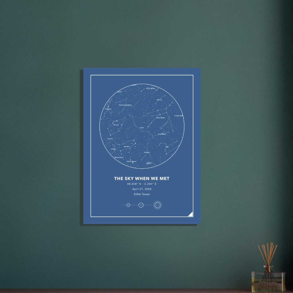 Blue star map with fine white border on a dark teal wall: “The sky when we met”, Eiffel Tower location, minimalist white graphics