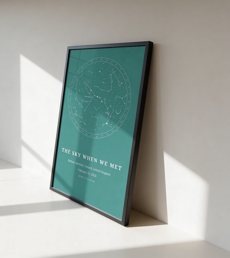 Custom star map poster in a slim frame: teal personalized night sky wall art with constellation names, Belfast title and coordinates, lifestyle photo